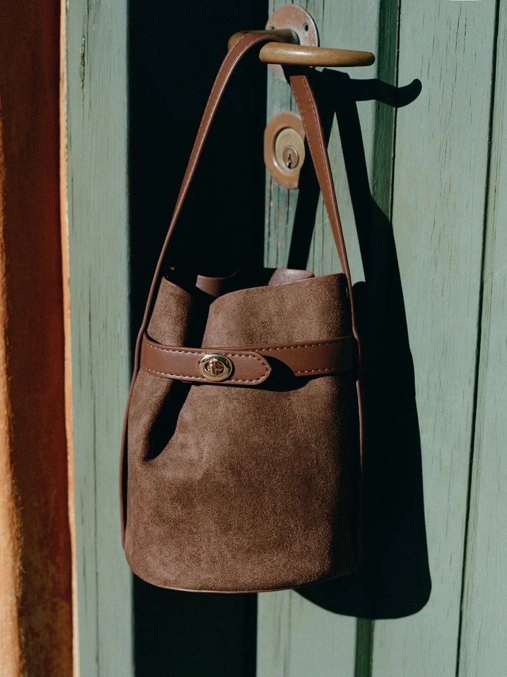 Anthropologie Brown faux suede bucket bag with leather strap and leather pouch